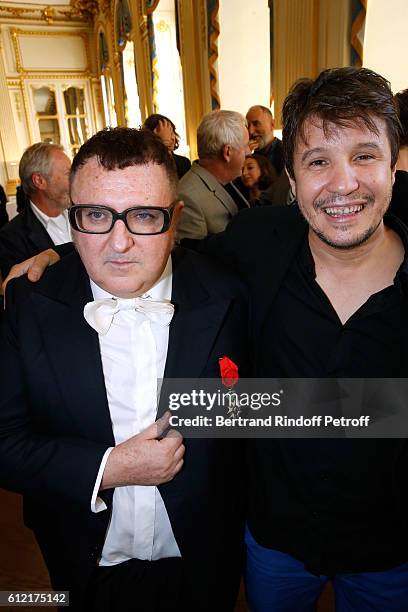 Alber Elbaz and contemporary artist Adel Abdessemed attend Alber Elbaz receives the Insigna of "Officier de la Legion d'Honneur" at Ministere de la...