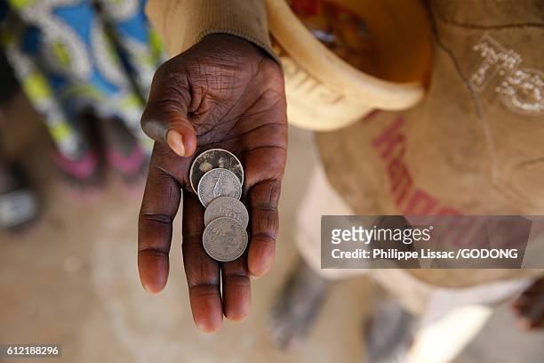 thousands of boys between 3 and 19, "talibes", beg on the streets of senegal for their food and for money to give to the "teacher" who controls them. - senegal africa stock pictures, royalty-free photos & images