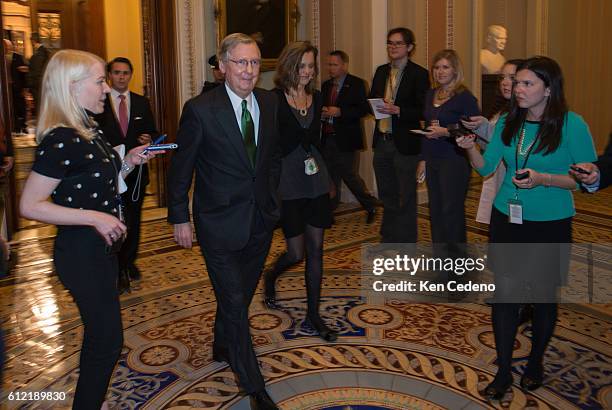Minority Leader Senator Mitch McConnell walks from the Senate floor to his office working in a possible deal to prevent the 'fiscal cliff', on...
