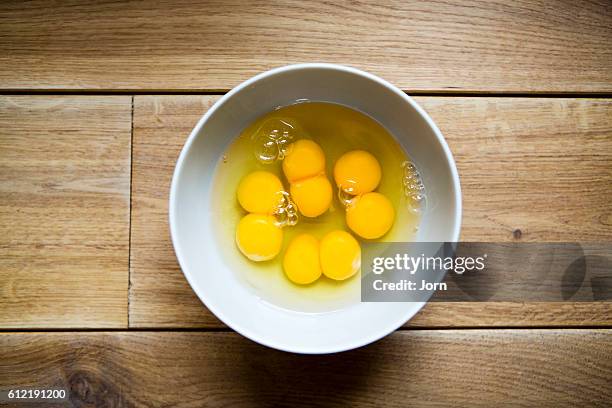 eggs in a bowl - egg yolk stock pictures, royalty-free photos & images