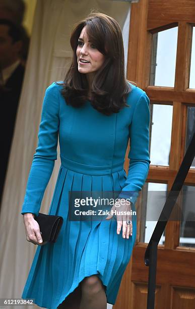 Catherine, Duchess of Cambridge, wearing a blue Emilia Wickstead dress and a Reiss coat, visits Action on Addiction in Warminster, WIltshire