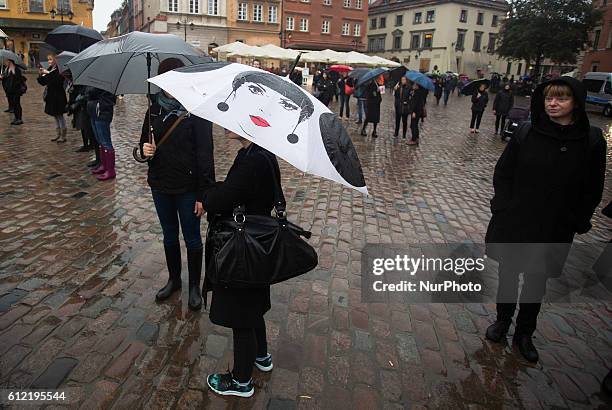 People attend the anti-government, pro-abortion demonstration on the Castle squar in Warsaw. 03 October Poland