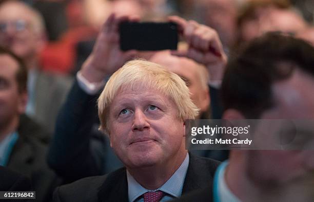 Foreign Secretary Boris Johnson listens to Secretary of State for International Trade Liam Fox speak on the second day of the Conservative Party...