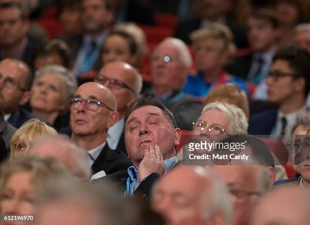 Delegates listen as the Secretary of State for International Trade Liam Fox speaks on the second day of the Conservative Party Conference 2016 at the...