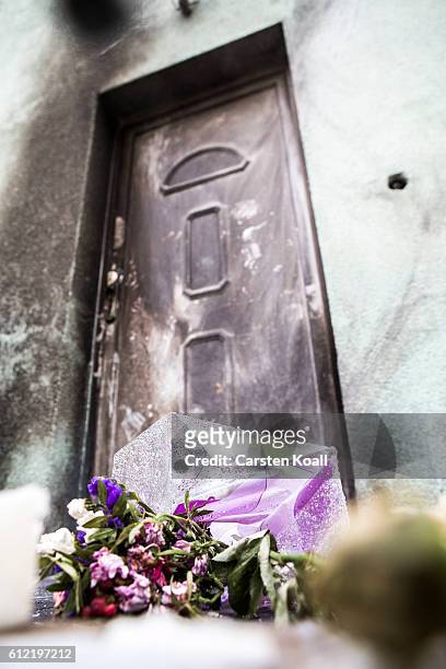 Empty candles lie in front of the soot-blackened door of the Fetih Camiine mosque, which a week before was hit by a bombing attack, on German Unity...