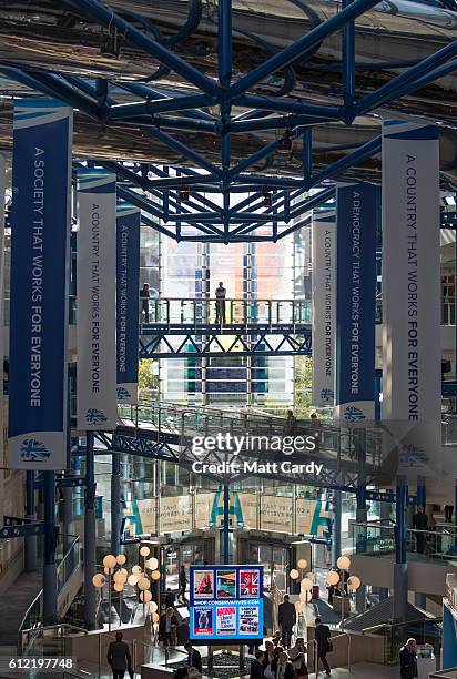 Delegates walk around the venue on the second day of the Conservative Party Conference 2016 at the ICC Birmingham on October 3, 2016 in Birmingham,...