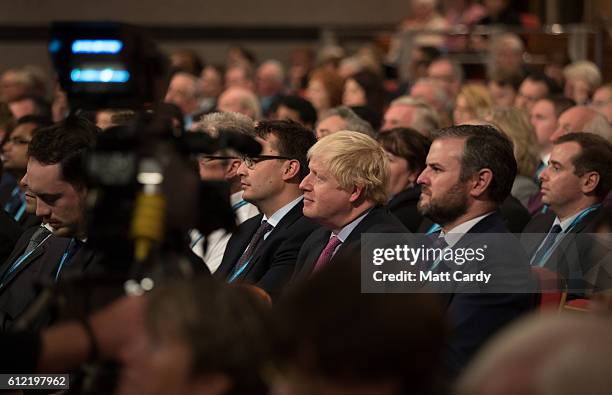 Foreign Secretary Boris Johnson listens to Secretary of State for International Trade Liam Fox speak on the second day of the Conservative Party...