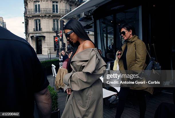 Kim Kardashian West and Kris Jenner leave 'L'Avenue' restaurant on October 2, 2016 in Paris, France.