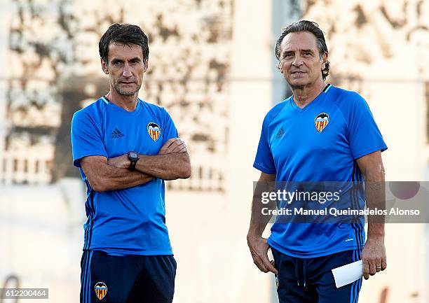 New Valencia CF manager Cesare Prandelli and his assistant Gabriele Pin look on during a training session at Paterna Training Centre on October 3,...