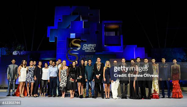 Milos Raonic of Canada, Andy Murray of Scotland and Rafael Nadal of Spain, Angelique Kerber of Germany pose for a group picture with other players...