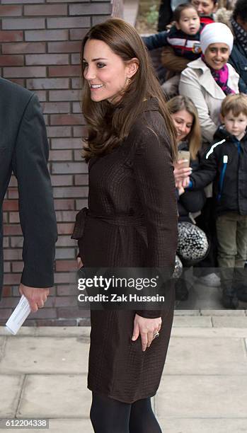 Catherine, Duchess of Cambridge, wearing a brown silk Hobbs dress, attends an event hosted by The Fostering Network to celebrate the work of foster...