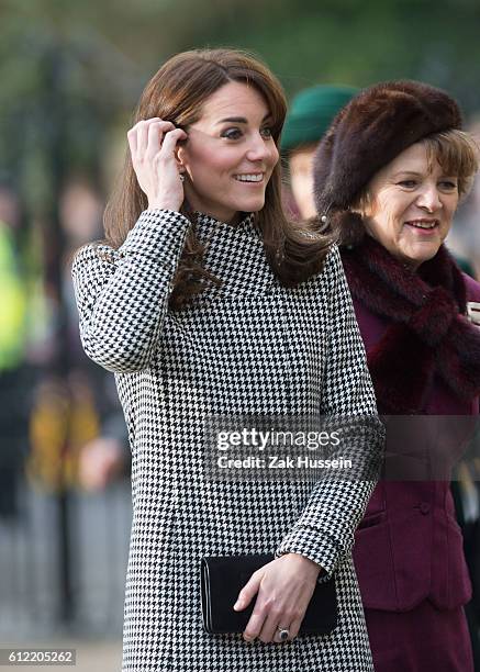 Catherine, Duchess of Cambridge, wearing a blue Emilia Wickstead dress and a Reiss coat, visits Action on Addiction in Warminster, WIltshire