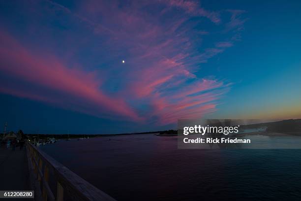 Sunset over Menemsha Sound in the town of Chilmark on Martha's Vineyard, MA over looking beach in the town of Aquinnah, formerly known at Gay Head on...