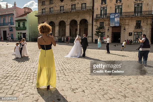 Wedding Photographer photographs a couple in Plaza San Francisco December 28, 2014 in Old Havana, Cuba. The United States announced last month that...