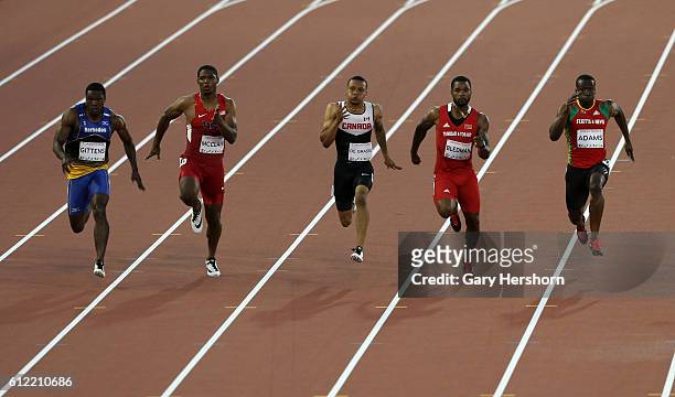 Andre De Grasse of Canada runs to the finish line ahead of Ramon Gittens of the Barbados, Remontay McClain of the USA, Keston Bledman of Trinidad and...