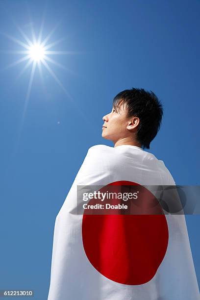 Young man wearing japanese flag