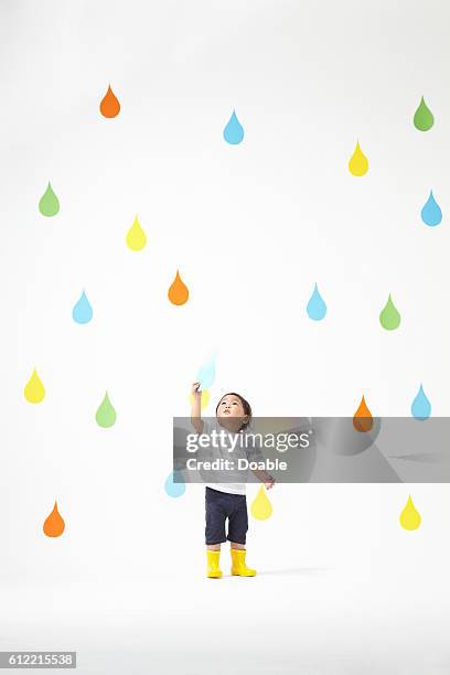 Boy Catching Raindrop