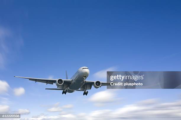 zoomed image of an airplane in the sky. tokyo prefecture, japan - plusphoto stockfoto's en -beelden