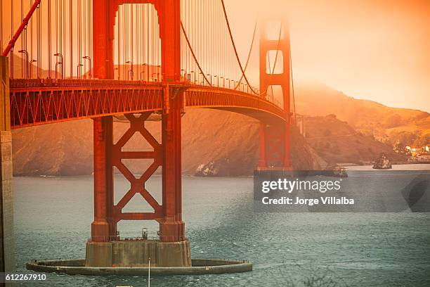 golden gate bridge in san francisco on a foggy day - golden gate stock pictures, royalty-free photos & images