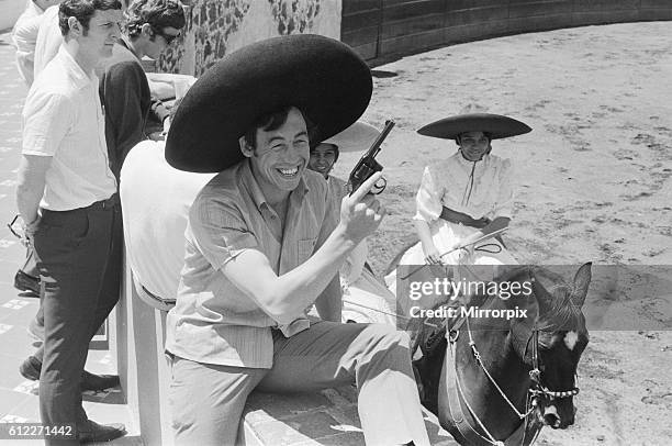 England goalkeeper Gordon Banks wearing a sombrero and holding a pistol at the Rodeo in the old Olympic village. 11th May 1970.