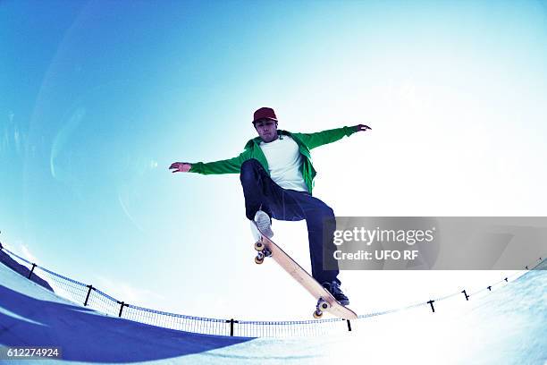 young man skateboarding - skating ストックフォトと画像