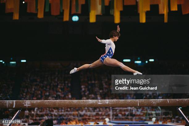 American gymnast Mary Lou Retton performs on the balance beam during the finals of the women's gymnastic team event at the 1984 Summer Olympic Games.