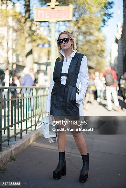 Celine Aagaard poses with a Loewe bag after the Hermes show at the Garde Republicaine during Paris Fashion Week Womenswear SS17 on October 3, 2016 in...