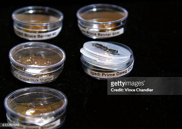 April 25, 2016: Cannabis concentrates, in this case shatter and budder, are on display at Lightshade, a marijuana dispensary on 6th Ave in Denver.