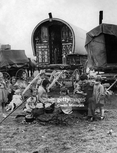 Gipsies Camps. A soldier plays with the children of a Gypsy Campon returning from the Western Front. January 1945 P007191