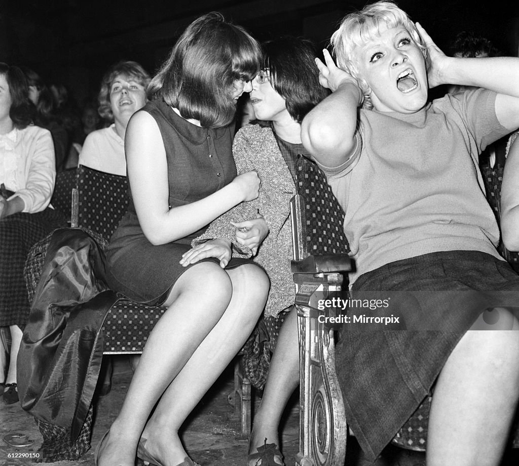 Screaming girl fans greet the Beatles on their appearance at the ABC Cinema in Wigan October 1964 S09149-001