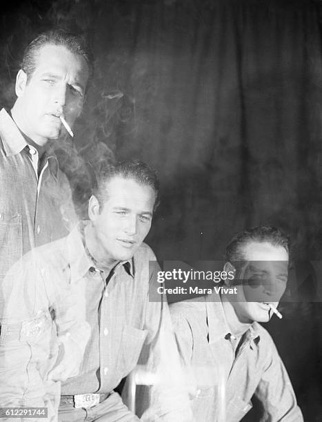 Triple exposure portrait of Paul Newman smoking.