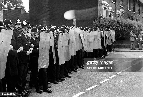Riot squad police with the new shields block off side street to Socialist demonstrators at the National Front meeting at Ladywood, Birmingham tonight...