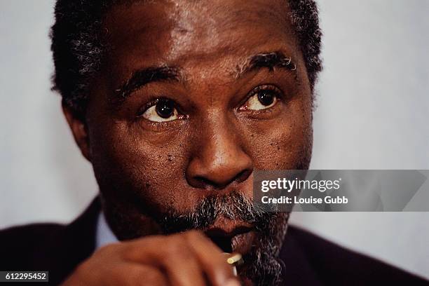 African National Congress leader Thabo Mbeki smoking a pipe while in Johannesburg, South Africa.