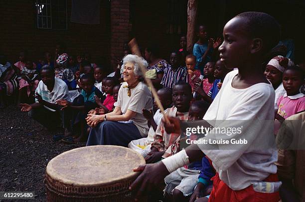 Old Woman Playing Instrument Photos and Premium High Res Pictures ...