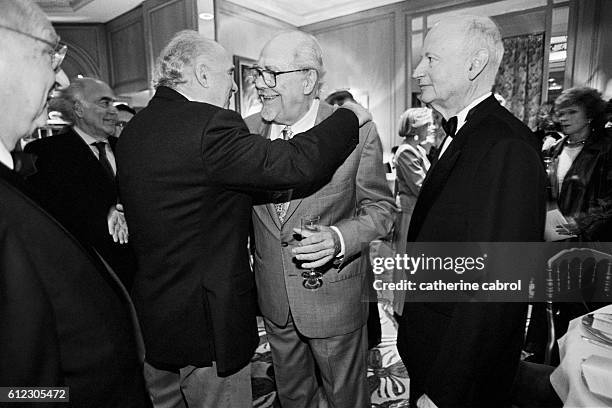 Gilles Jacob watches as Michel Piccoli hugs Robert Altman in greeting.