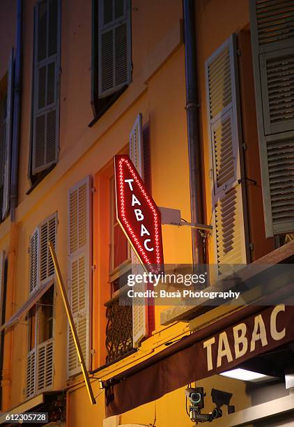 typical "tabac", french tobacco store sign in nice, france - store sign stockfoto's en -beelden
