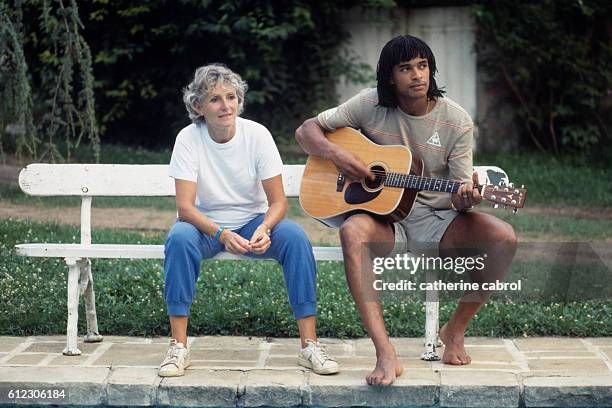 Tennis player Yannick Noah and his mother Marie-Claire Noah in the countryside in Normandy.