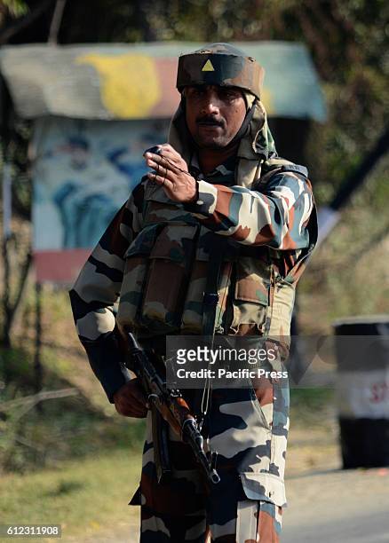 Indian troopers stand alert outside the base camp which was attacked by suspected militants at Baramulla on Oct 03 Indian controlled Kashmir....