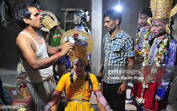 An Indian makeup artist prepare an artist as Seeta to take part in a religious procession known as 'Ram Barat' / Lord Ram's marriage ceremony during...