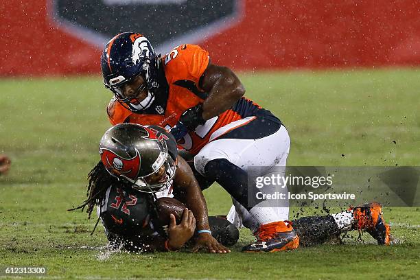 Tampa Bay Buccaneers running back Jacquizz Rodgers is tackled by Denver Broncos outside linebacker Corey Nelson during the NFL regular season game...