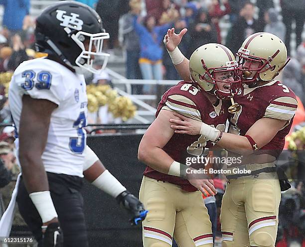 Boston, MA Boston College Eagles Charlie Calinan celebrates his touchdown reception with teammate Michael Walker against the Buffalo Bulls during...