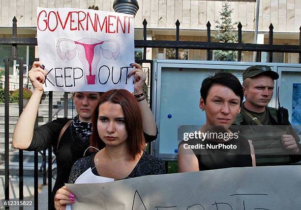 Ukrainian activists hold placards in their hands during protest to support the nationwide Polish womens strike,in front of the Embassy of Poland in...