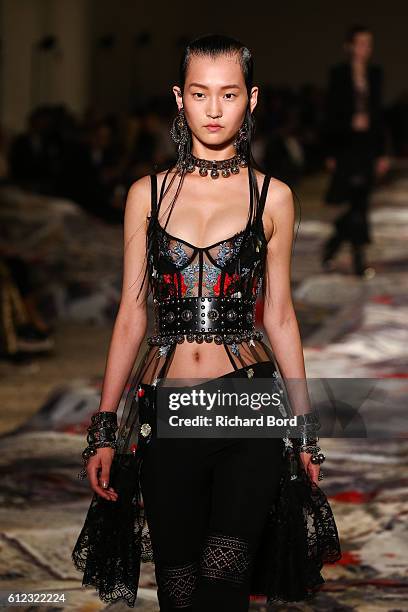 Model walks the runway during the Alexander McQueen show as part of the Paris Fashion Week Womenswear Spring/Summer 2017 at "Orangerie du Senat" on...