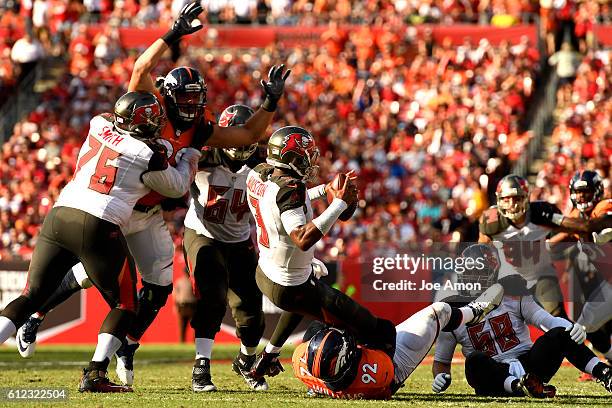 Denver Broncos nose tackle Sylvester Williams gets to Tampa Bay Buccaneers quarterback Jameis Winston for a loss at Raymond James Stadium in Tampa...