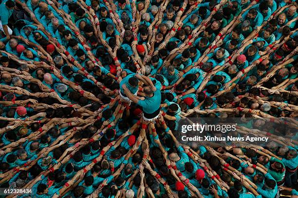 Oct. 2, 2016 -- Members of a human tower group perform during the 26th Human Towers Competition in the old bullring of Tarragona, Spain, Oct. 2, 2016.