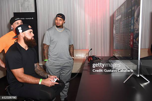 Miami Dolphins player Koa Misi and Mike Pouncey attend the Xbox & Gears Of War 4 Miami Launch Event at Briza On The Bay on October 3, 2016 in Miami,...