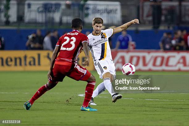 Dallas midfielder Kellyn Acosta challenges a pass by Los Angeles Galaxy midfielder Steven Gerrard during the MLS match between LA Galaxy and FC...