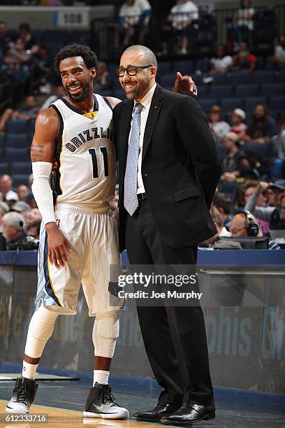 Head coach David Fizdale of the Memphis Grizzlies shakes hands with Mike Conley of the Memphis Grizzlies during the game against the Orlando Magic...