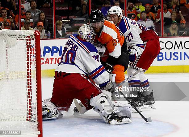 Jakub Voracek of the Philadelphia Flyers scores the game winning goal as Mackenzie Skapski of the New York Rangers defends during a preseason game on...