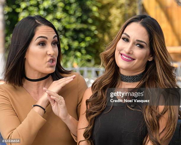 Brie Bella and Nikki Bella visit "Extra" at Universal Studios Hollywood on October 3, 2016 in Universal City, California.